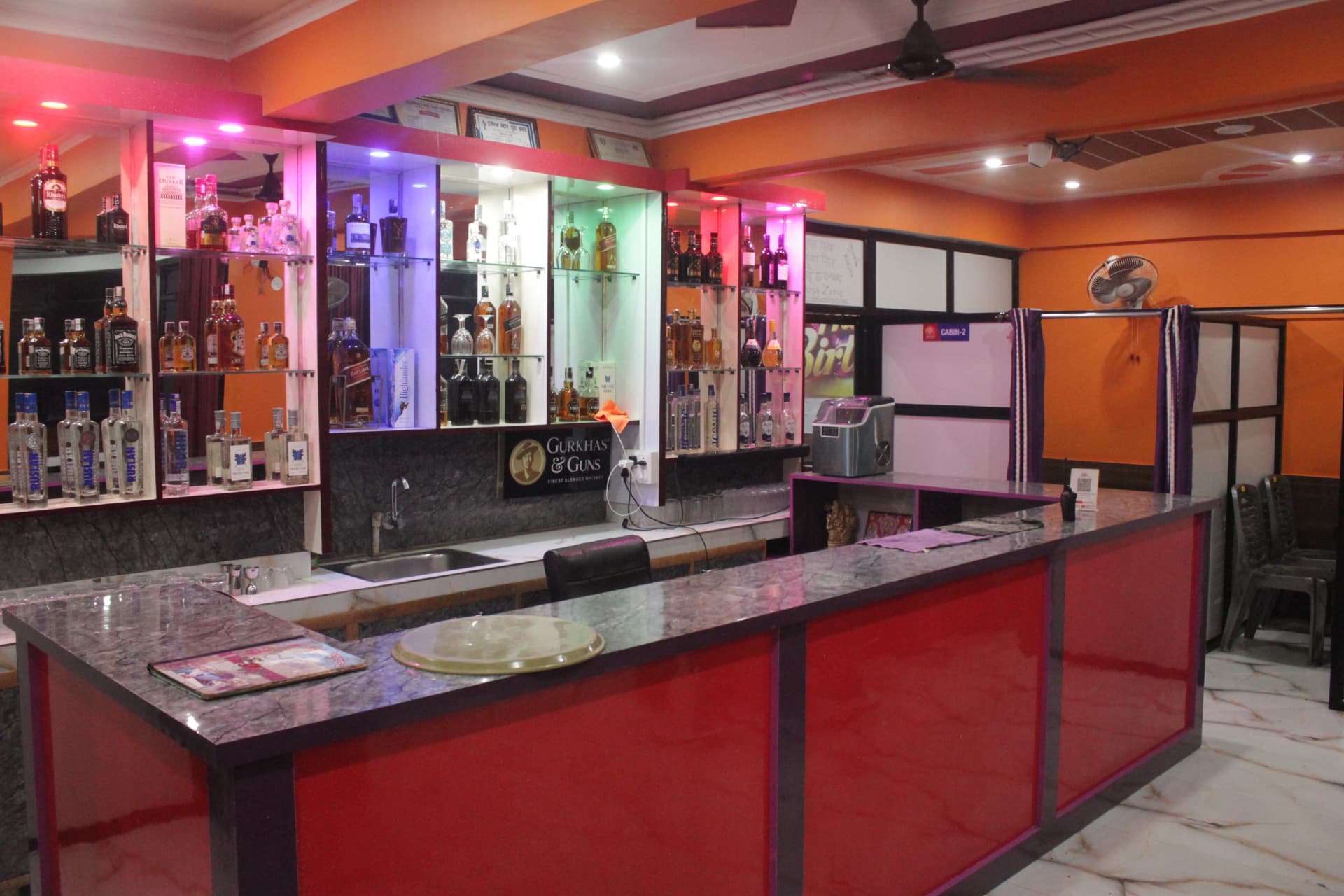 The Jannat bar counter with a full display of bottles